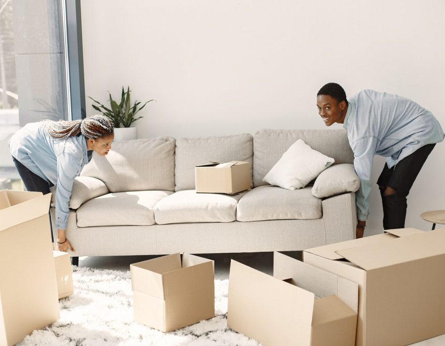 young-couple-moving-new-home-together-african-american-couple-with-cardboard-boxes_1157-40330